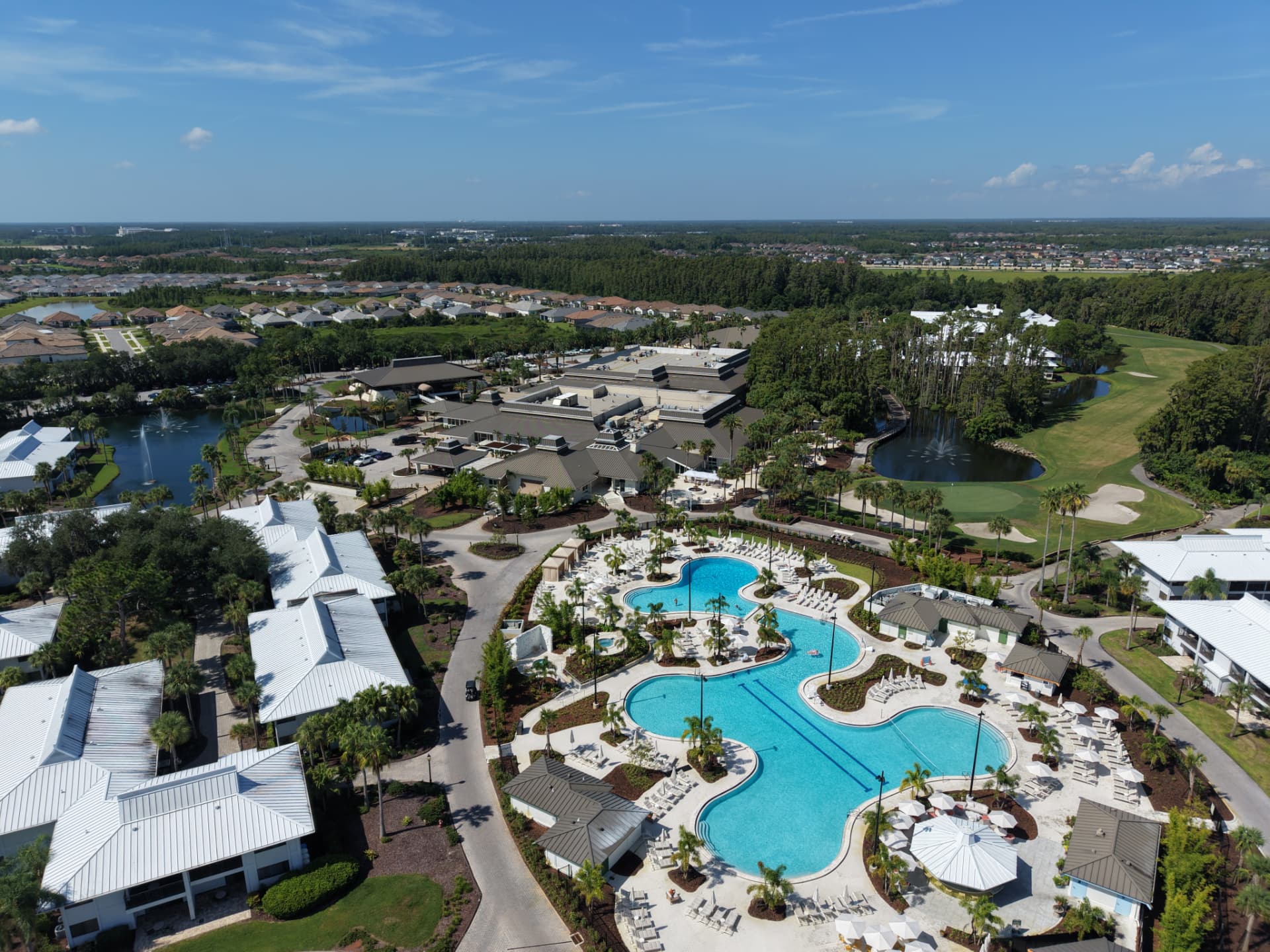 Aerial view of Saddlebrook's resort pools, golf course, and landscaped grounds in Wesley Chapel