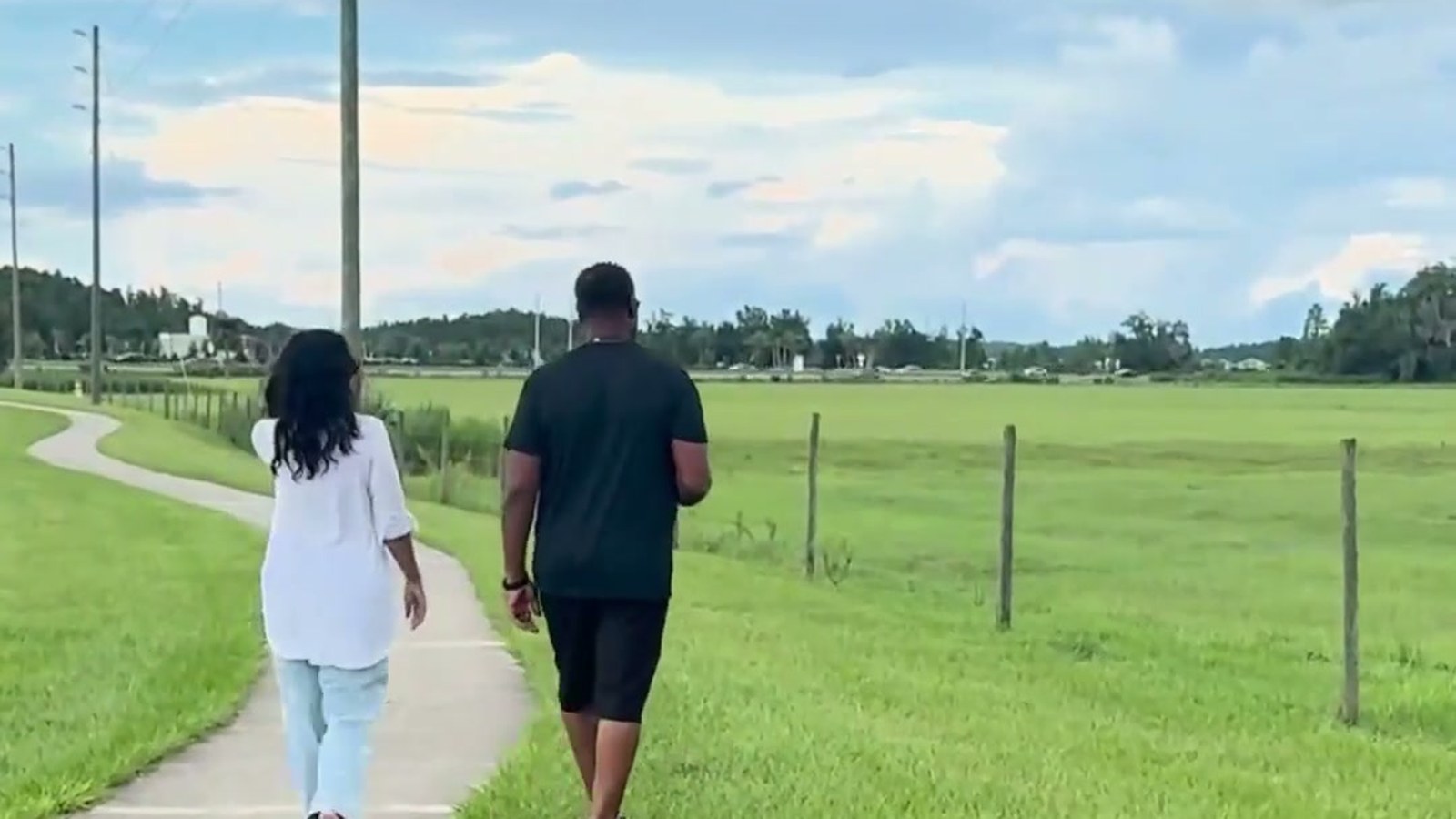 Jevon and Cindy Williams walking along SR 56 in the Wiregrass Ranch area of Wesley Chapel near the planned Fresh Market development.