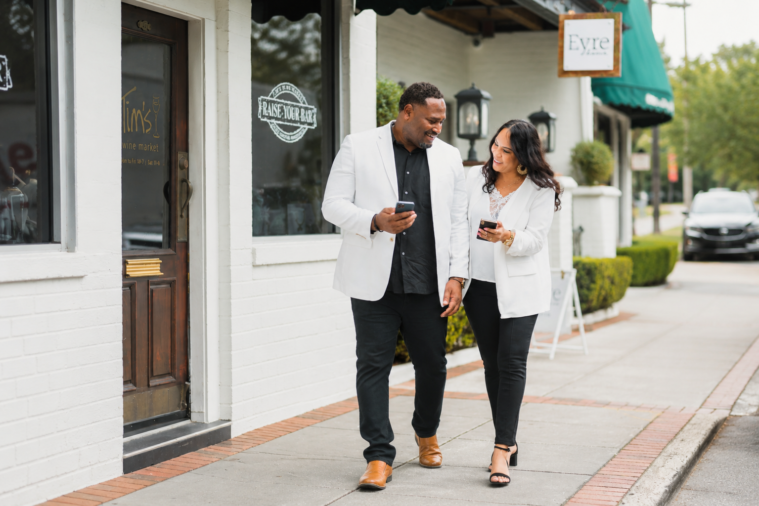Jevon and Cindy Williams in conversation on a village street
