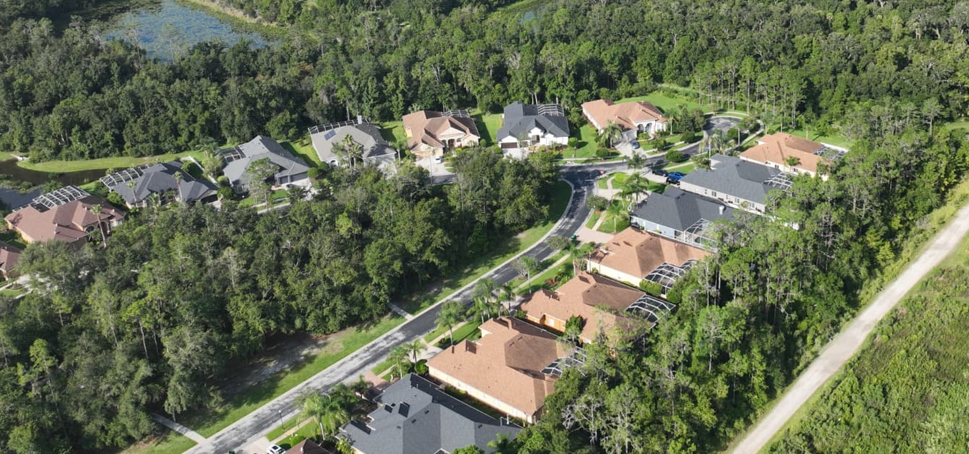 Aerial view of homes, lakes and mature landscaping in the Seven Oaks area of Wesley Chapel, Florida