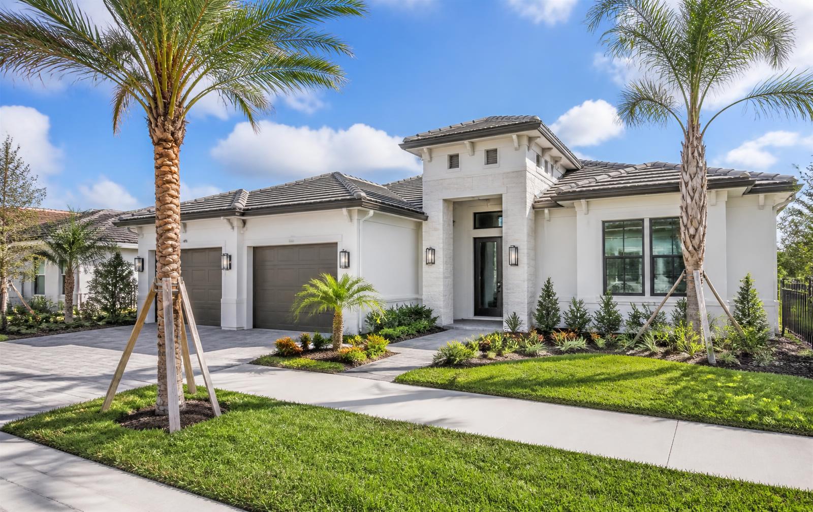 A bright contemporary new-construction home with fresh landscaping in a Wesley Chapel-area master-planned community